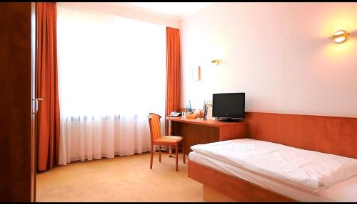 Postel nebo postele na pokoji v ubytování Hotel Royal