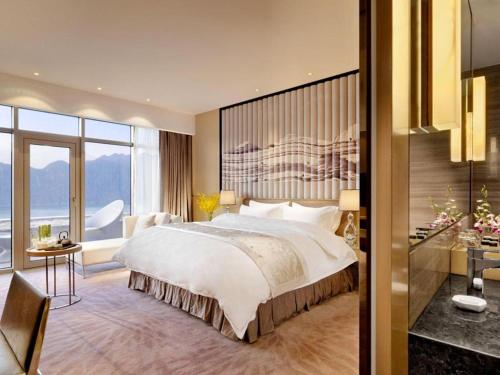 Ένα ή περισσότερα κρεβάτια σε δωμάτιο στο CITIC Jinling Hotel