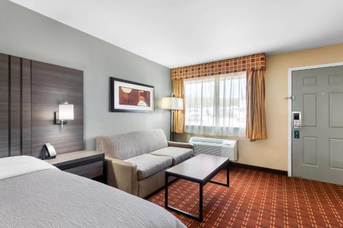 Ένα ή περισσότερα κρεβάτια σε δωμάτιο στο Quality Inn Marshall
