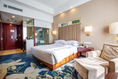 Postel nebo postele na pokoji v ubytování Inzone Garlnd Hotel Zhangqiu