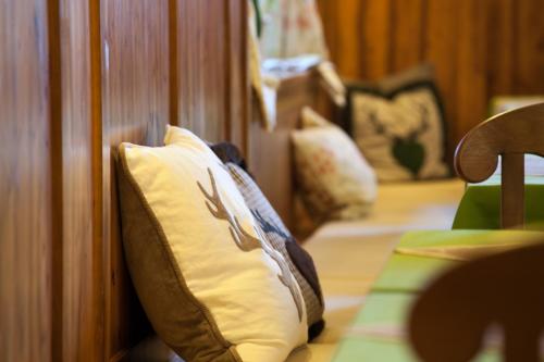 two pillows sitting on a couch in a room at Zum Fally - Landgasthof in Kirchberg am Wechsel