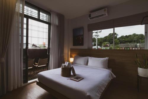 Postel nebo postele na pokoji v ubytování Sirichai Design Hotel