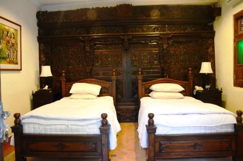 Кровать или кровати в номере Jogloplawang Villa&Resort