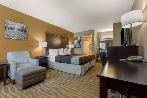 a hotel room with a bed and a desk at Best Western Taylor Inn in Taylor