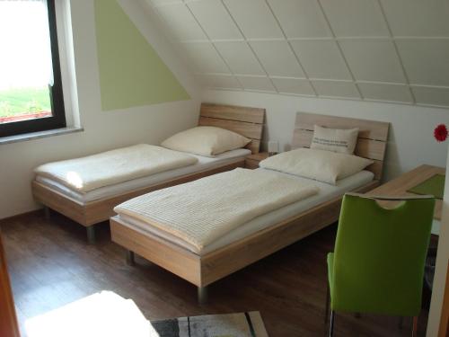 מיטה או מיטות בחדר ב-Pension-Eula