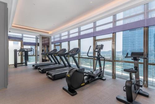a gym with treadmills and ellipticals in a building at Mercure Guangzhou Financial City in Guangzhou