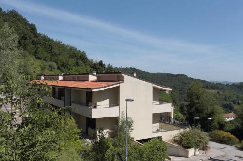 a white building with a red roof at Residence Città Ideale in Urbino