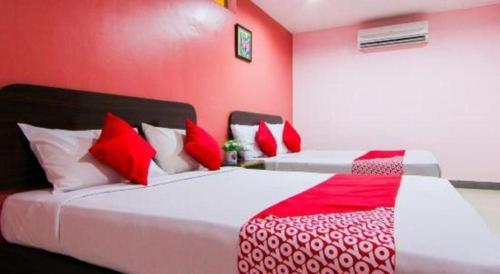Katil atau katil-katil dalam bilik di OYO 11343 Hotel Putra Iskandar