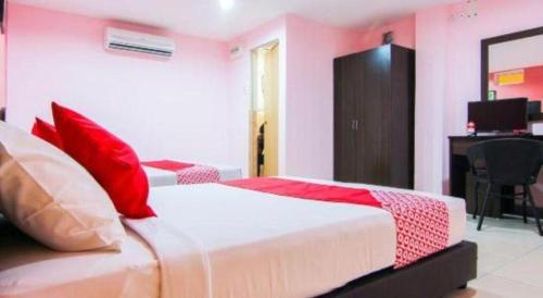 Katil atau katil-katil dalam bilik di OYO 11343 Hotel Putra Iskandar