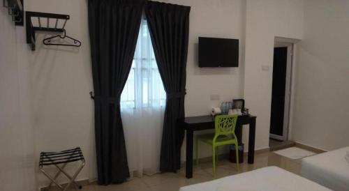 Katil atau katil-katil dalam bilik di Hotel Seri Geliga