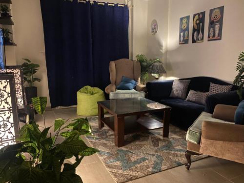 a living room with a couch and a table at AQUA View resort in El Alamein