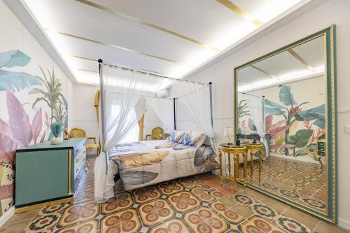 a bedroom with a canopy bed and a table and chairs at Montecelio Golden House in Guidonia