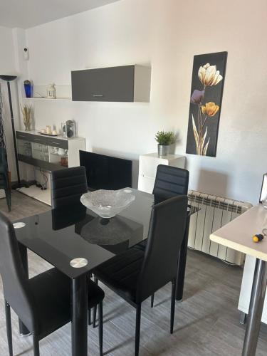 a dining room and kitchen with a table and chairs at Apartment zona Naturista in Vera
