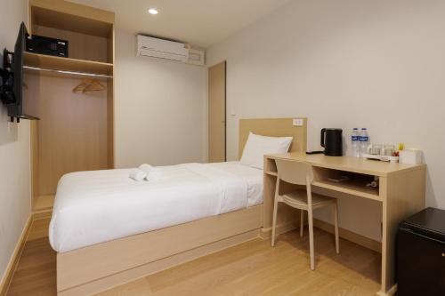 Takka Hotel - Bearingにあるベッド