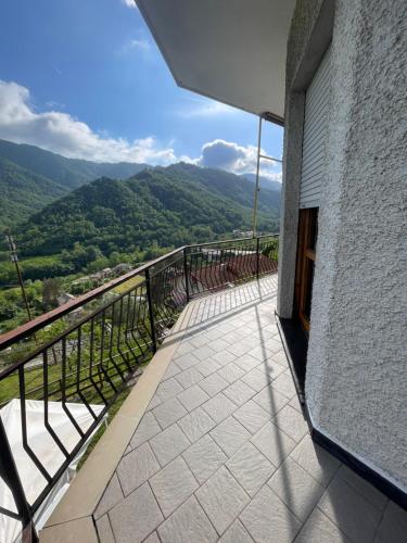 a balcony with a view of the mountains at La casa by M&G vacation home in Soglio