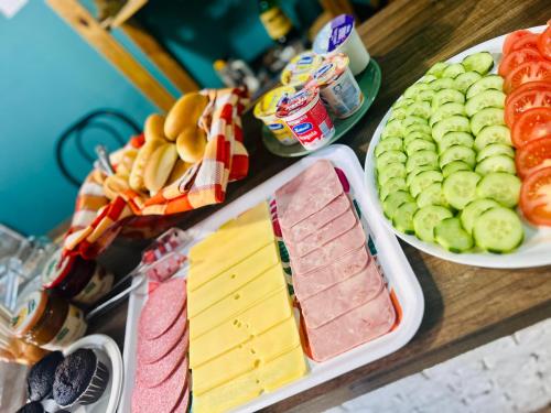 a buffet with different types of fruits and vegetables at Balarm - Hostel and Bar in Palermo