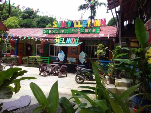 a building with a sign that reads sushiarmaarma at mama hostel Bed & Breakfast in El Nido