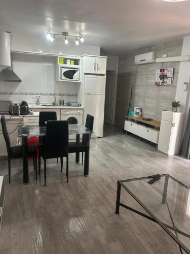 a kitchen and dining room with a table and appliances at Apartment zona Naturista in Vera
