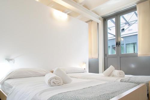 Postel nebo postele na pokoji v ubytování Casa Ideale 5 Lecco