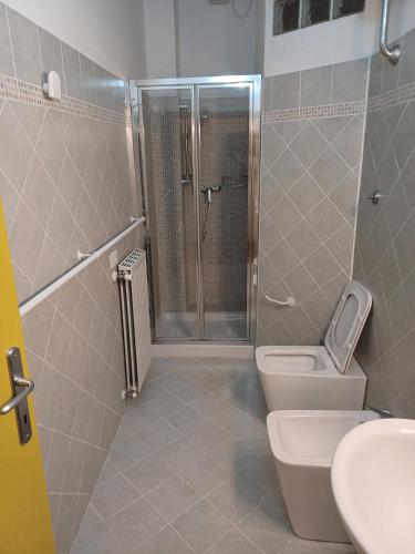 a bathroom with a shower and a toilet and a sink at Il Caminetto in Montecastrilli