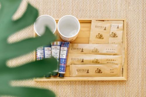 a wooden tray with toothbrushes and other products on it at Guan Erjie Boutique Hotel (Huimin Street of Xi'an Bell Tower ) in Xi'an