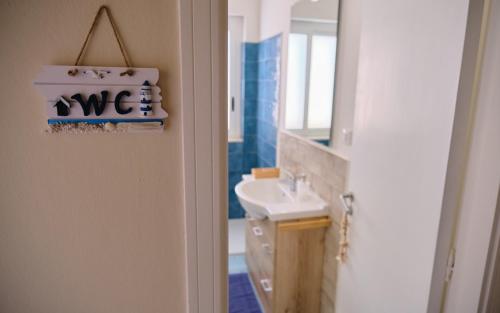 a bathroom with a sink and a mirror at B&B Faro di Luce in Augusta