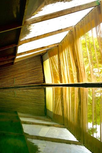 an inside view of a room with a curtain at Dar Tawarta Guest House Dakhla in Dakhla