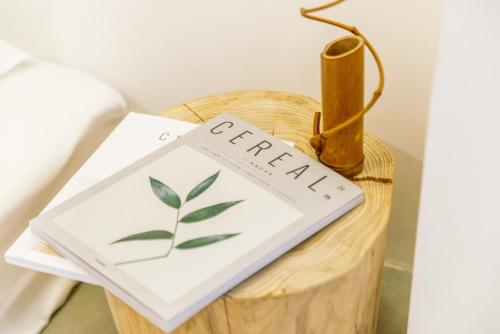 a book sitting on top of a wooden table at Guan Erjie Boutique Hotel (Huimin Street of Xi'an Bell Tower ) in Xi'an