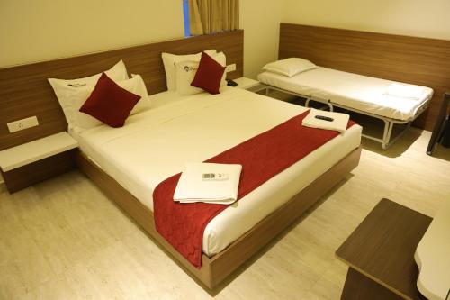 Postel nebo postele na pokoji v ubytování Hotel Amoha