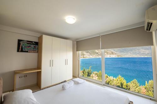 Postel nebo postele na pokoji v ubytování Stone Beach Residence - Adults Only Resort