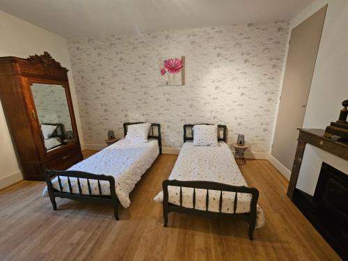 Postel nebo postele na pokoji v ubytování Le gîte de la Rose