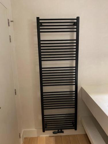 a black and white shelf in a closet at Business Accommodation Luxury Loft in Geel