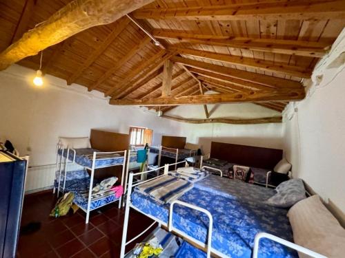 Postel nebo postele na pokoji v ubytování Albergue El Palomar