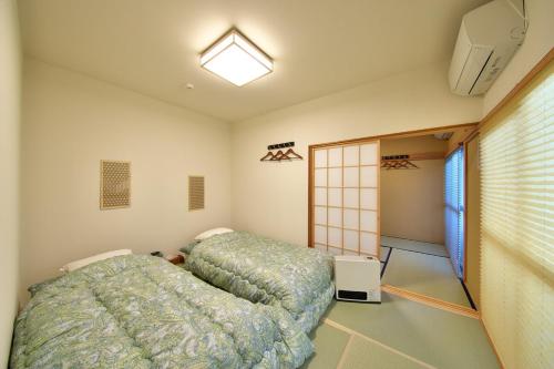 Postel nebo postele na pokoji v ubytování 箱根御泊処-縁- 044h