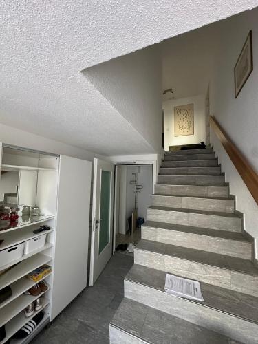 a staircase in a house with a stair case at VK - VB - Zürich Airport - Homestay - Villa Bänikon in Kloten