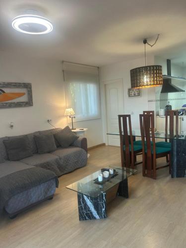 a living room with a couch and a table at Apartment zona Naturista in Vera