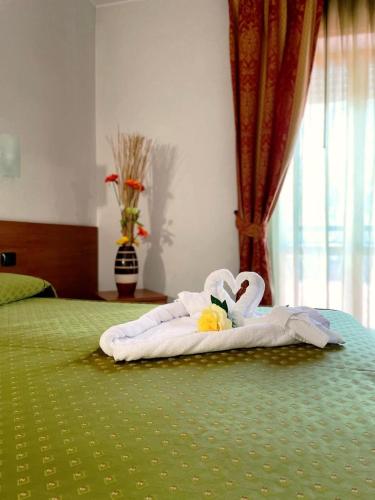 Postel nebo postele na pokoji v ubytování Hotel Villa Giusy