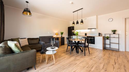 Kuchyň nebo kuchyňský kout v ubytování Jantar Resort Flatbook - Wynajem Apartamentów nad Morzem