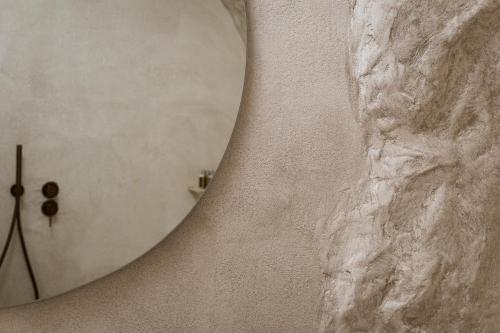 a close up of the shoulder of a woman at One of One Hotel in Imerovigli