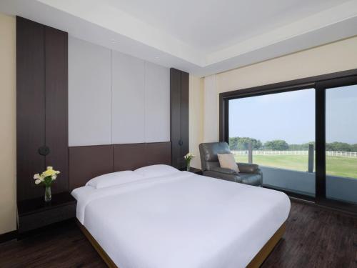 Voodi või voodid majutusasutuse Amber Pure Hill Hotels & Resorts Jeju toas