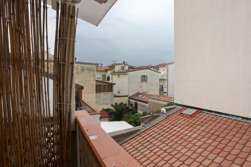 an apartment balcony with a view of the city at La Perla Del Lido a Camaiore in Lido di Camaiore