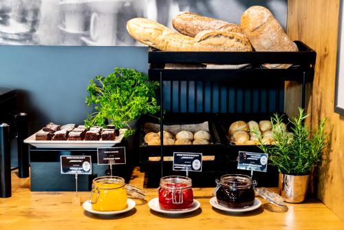 a display of bread and pastries in a bakery at Ibis Poznan Stare Miasto in Poznań