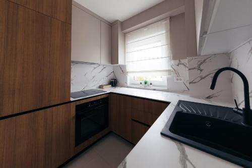 Η κουζίνα ή μικρή κουζίνα στο Apartman Pinjuh