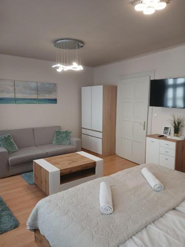 Postel nebo postele na pokoji v ubytování Soda apartman