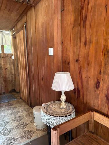 a lamp sitting on a table in a room at The Sound Of Silence Homestay Đà Lạt in Da Lat