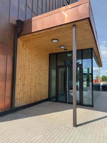 an external view of a building with glass doors at Teguri Apartments in Tartu