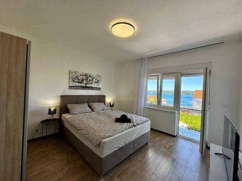 Postel nebo postele na pokoji v ubytování APARTMANI KIKI