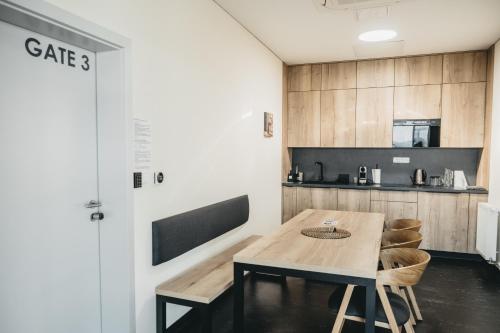 a kitchen with a table and chairs in a room at Apartmány Hangár Strakonice in Strakonice