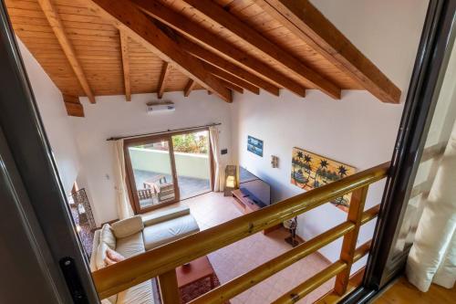 a view of the living room from the balcony of a house at Porto Antigo 1 - Three Bedroom, Pool & Wifi in Santa Maria