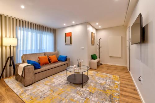 a living room with a couch and a table at Terro Collection - Dom Pedro V in Braga